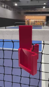 Pickleball net phone holder recording a game